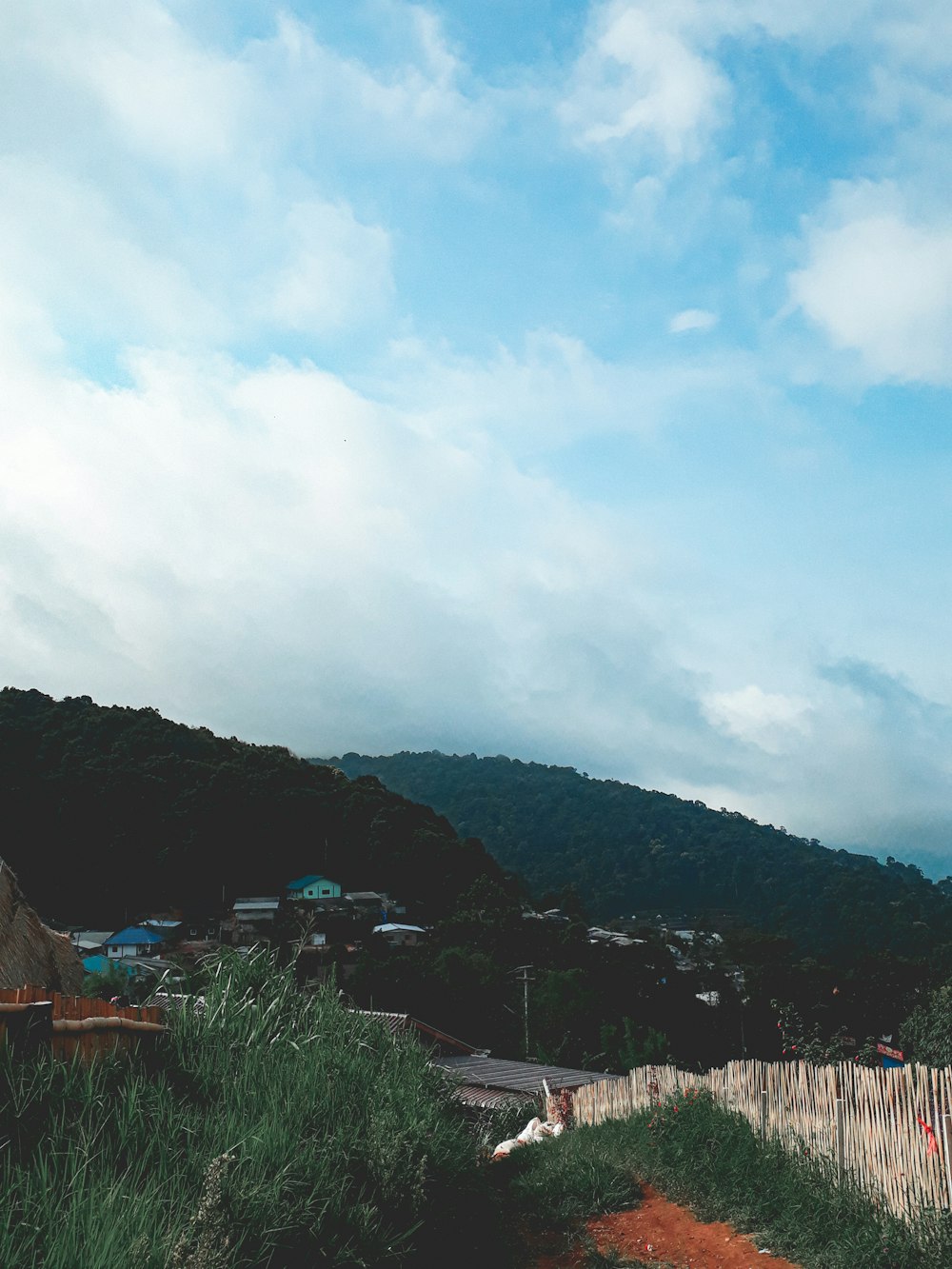 houses on cliff under blue sky