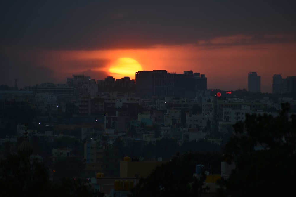 gray buildings at sunset