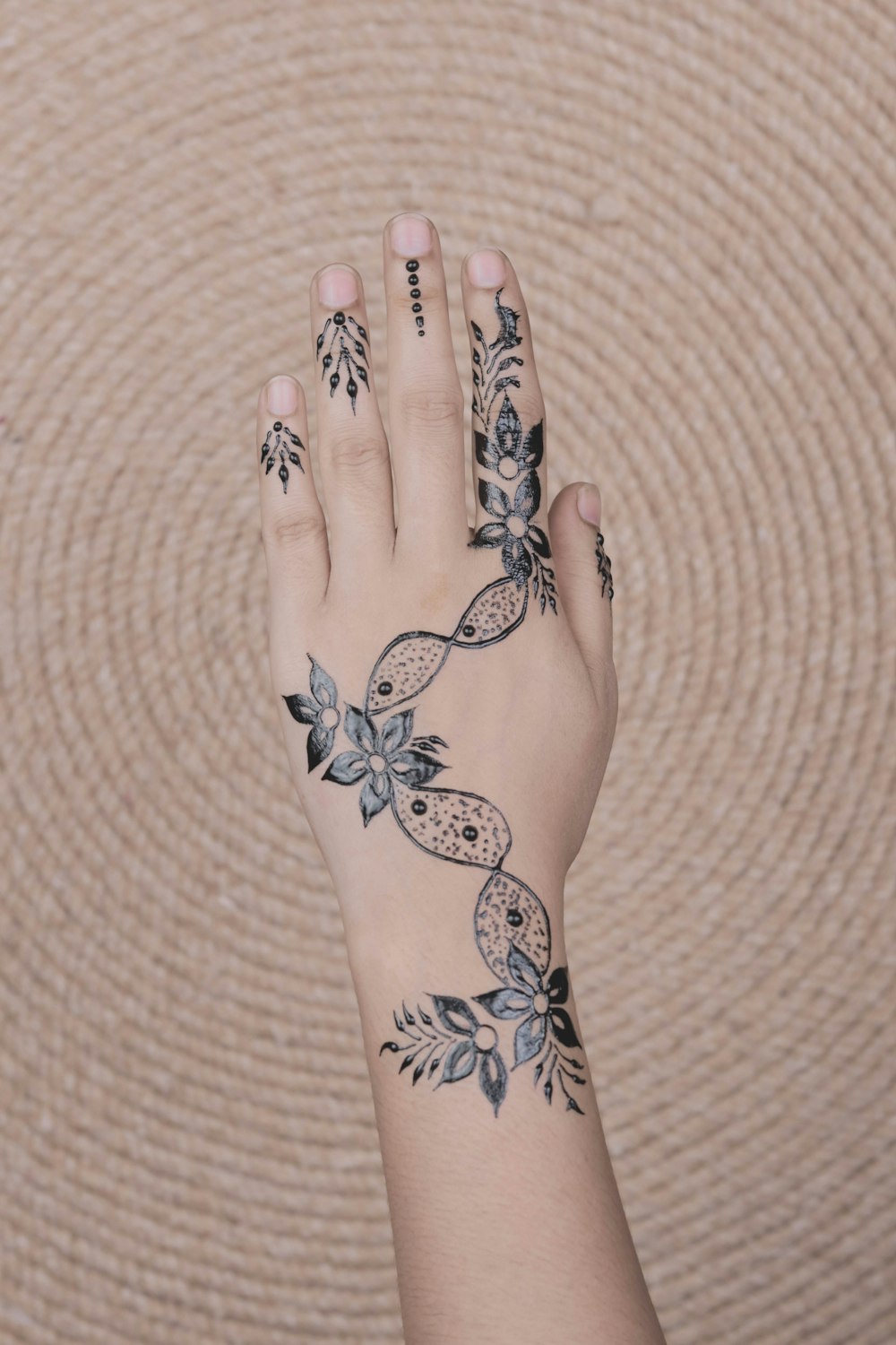 person in black floral tattoo