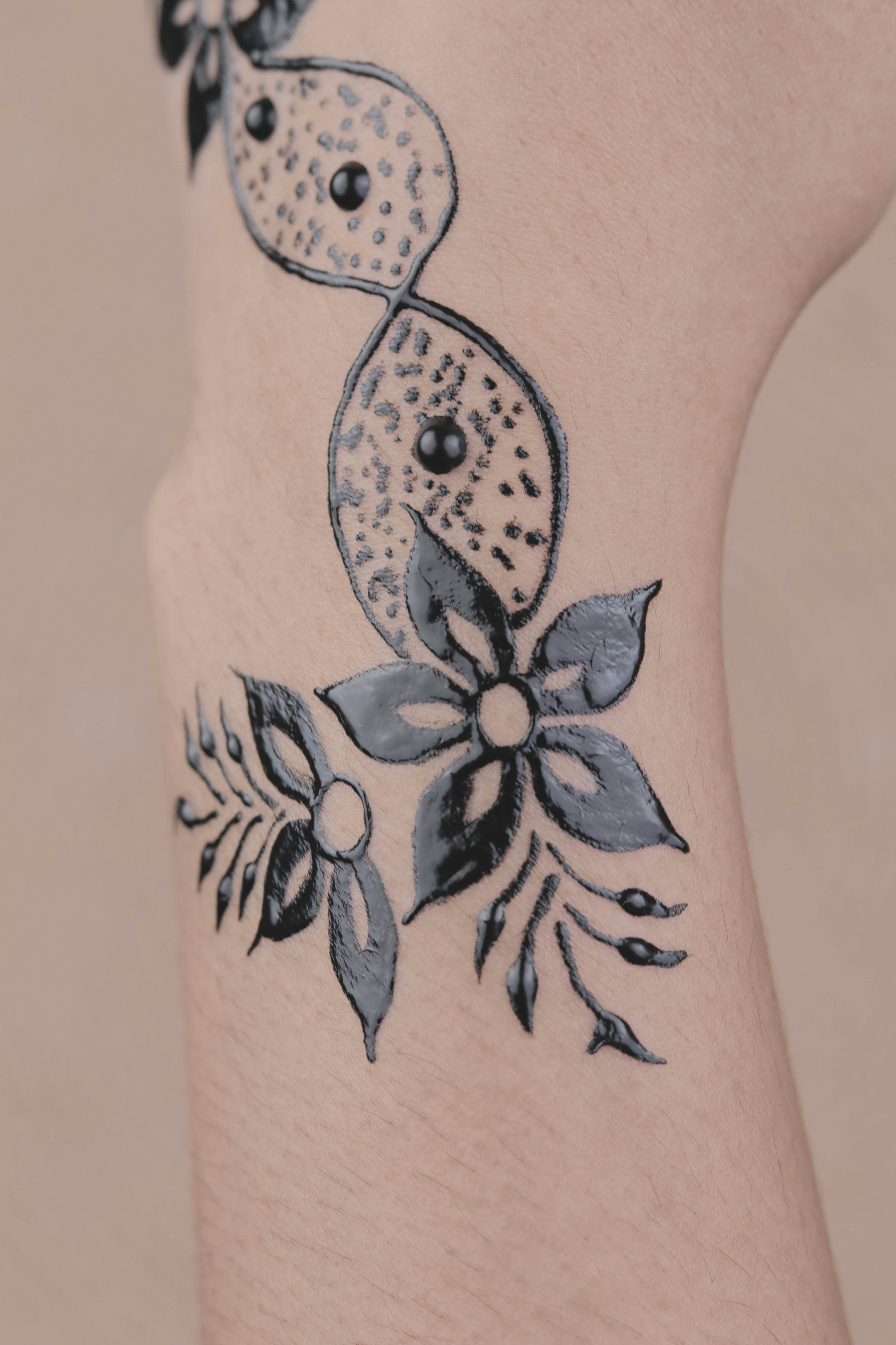 Black flower hand tattoo photo Free Grey Image on Unsplash