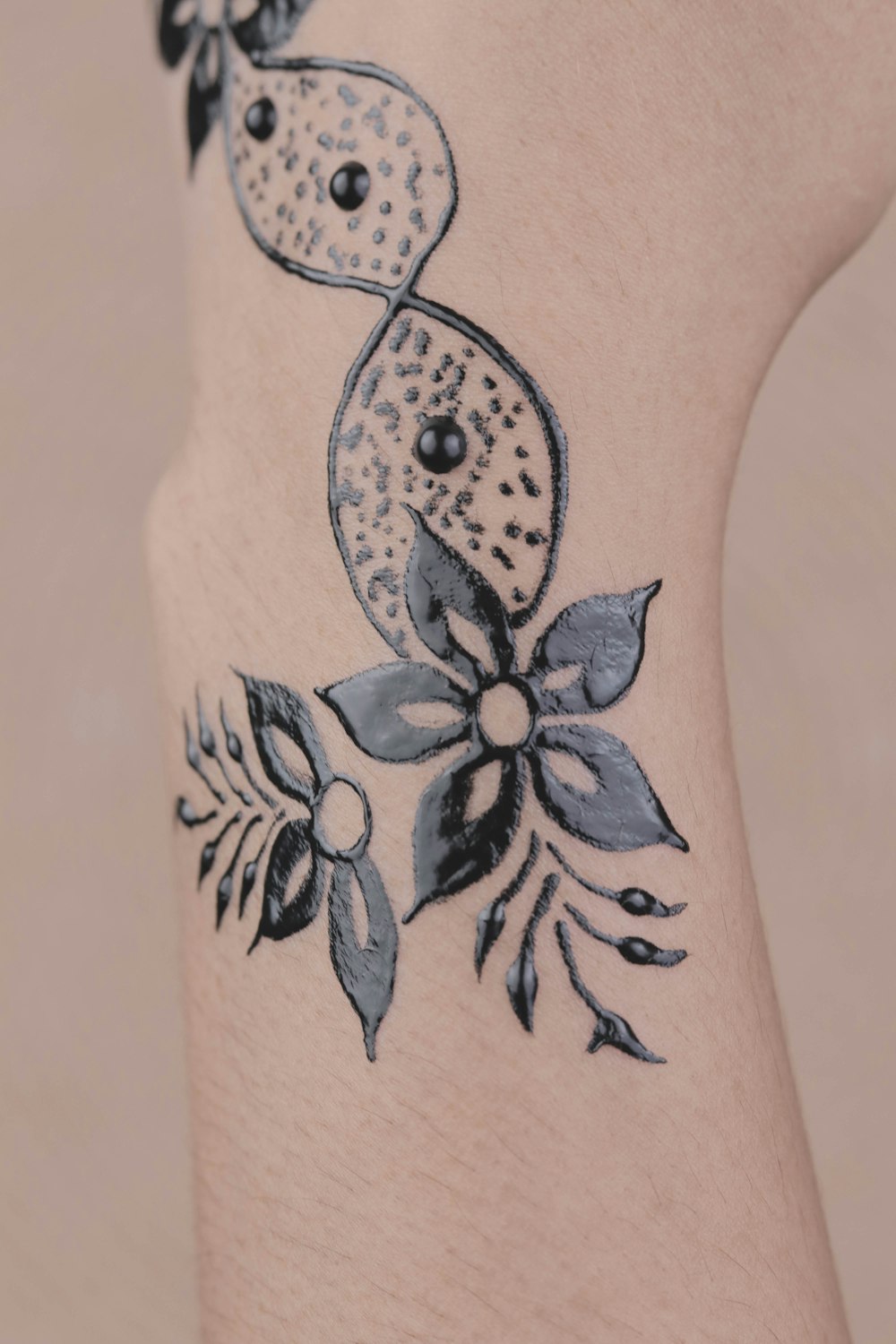 black flower hand tattoo
