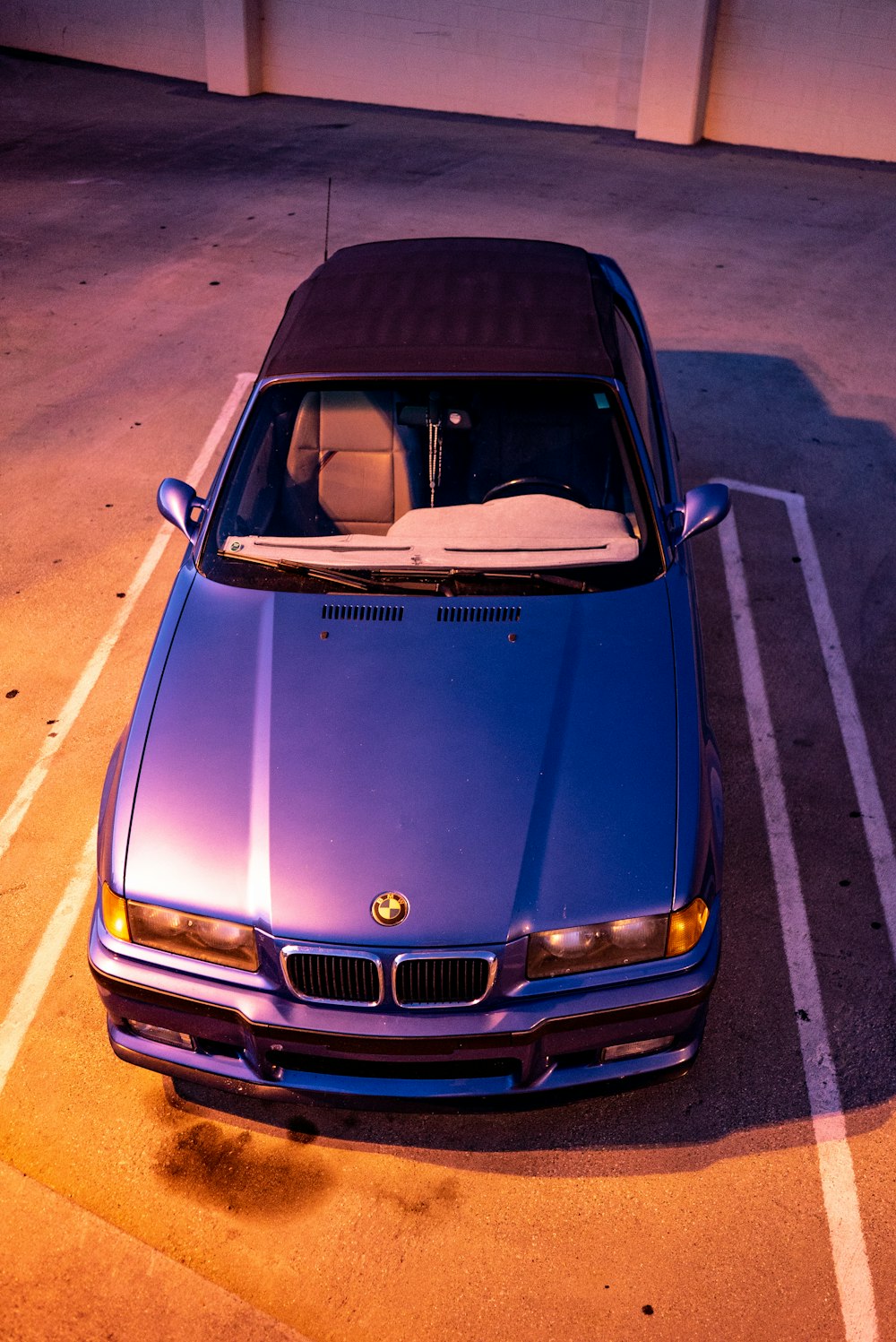 parked blue BMW sedan