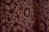 A close-up of delicate fabric textures showcasing elegant patterns.
