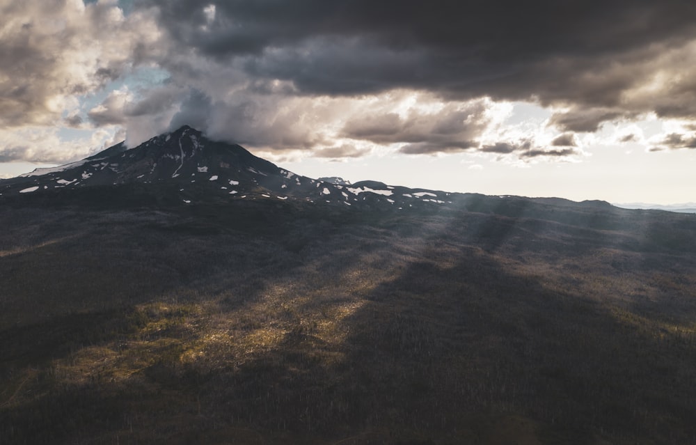 silhouette photography of mountain during daytie