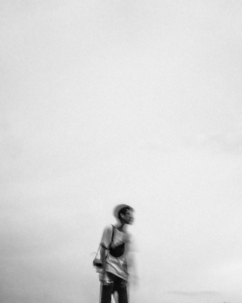 a black and white photo of a person on a skateboard