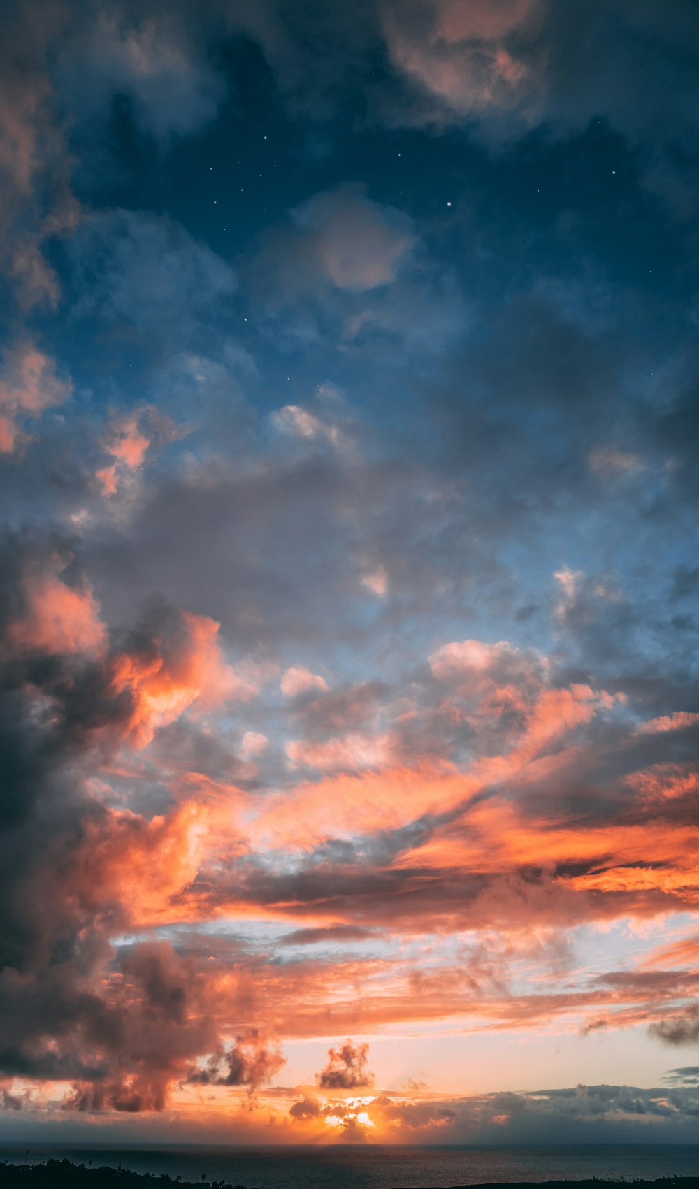 blue, orange, and gray skies