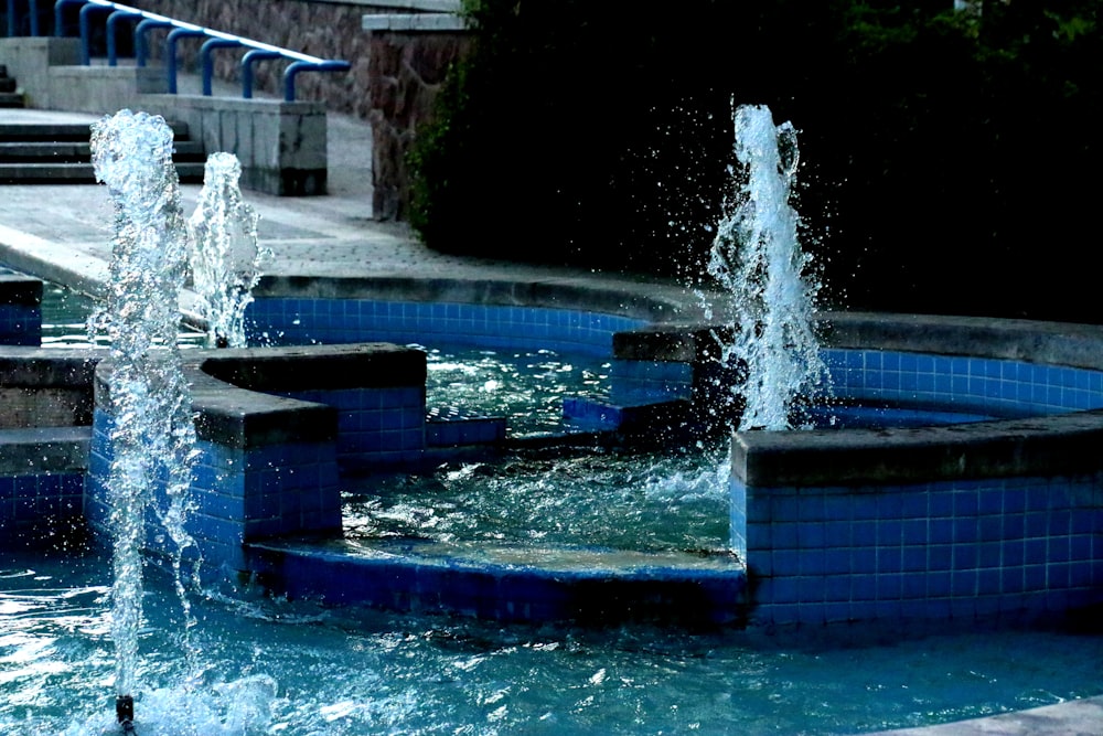 blue and black outdoor water fountain