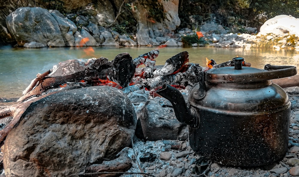 gray kettle on charcoal burner