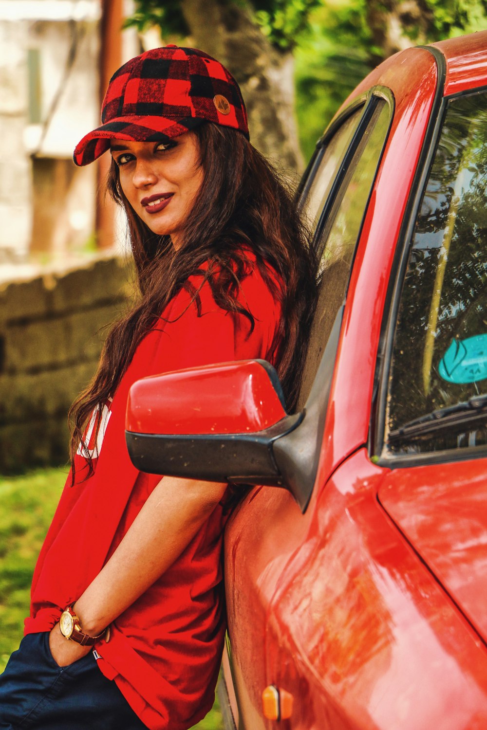 woman standing and leaning on vehicle