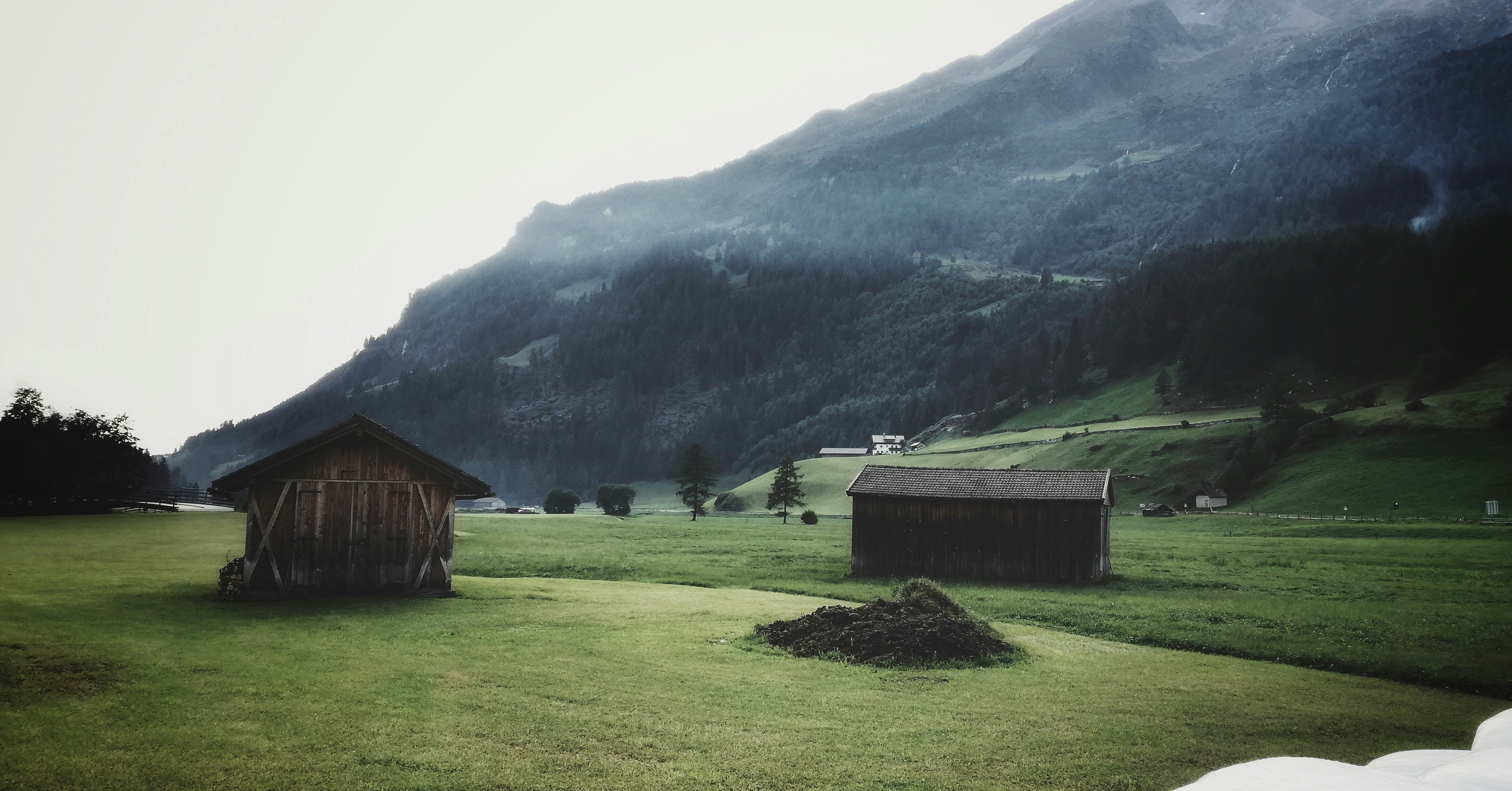 sheds on grass field