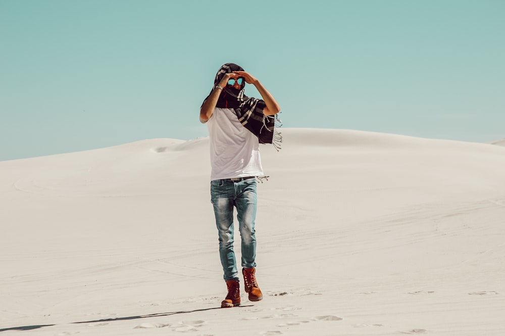 man standing on desert