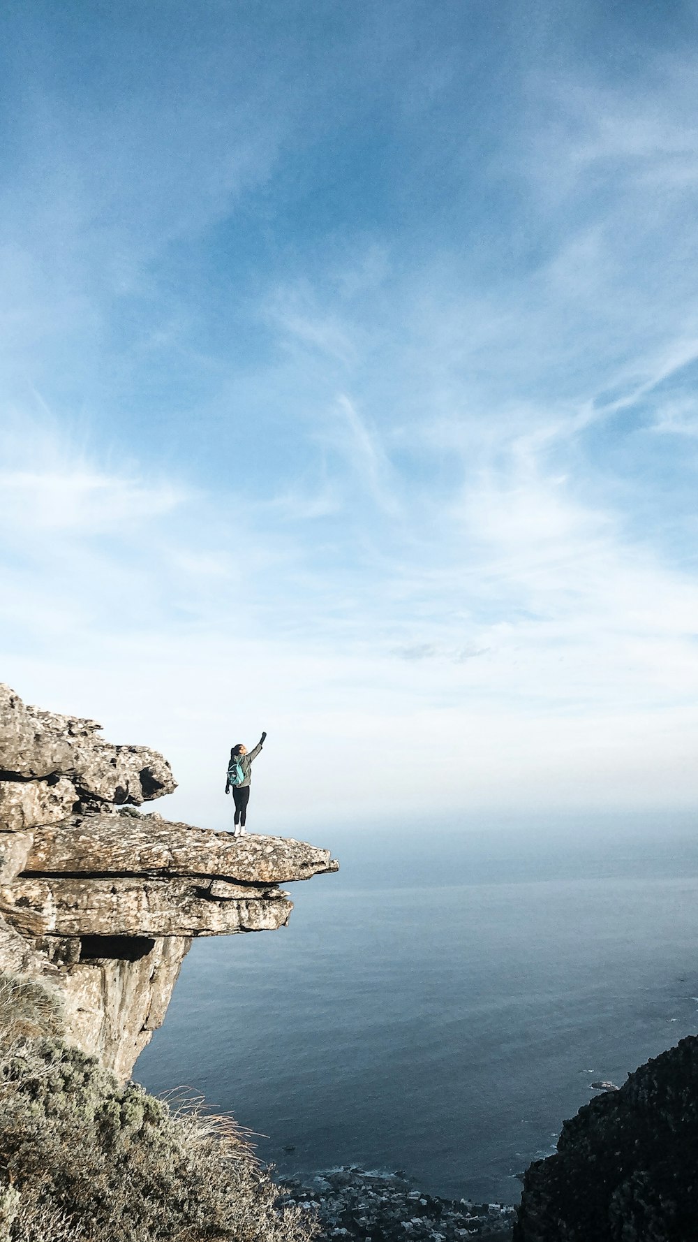 person standing at edge of cliff