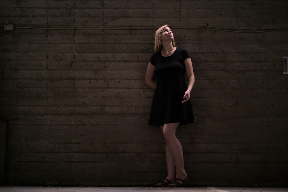 woman leaning on wall