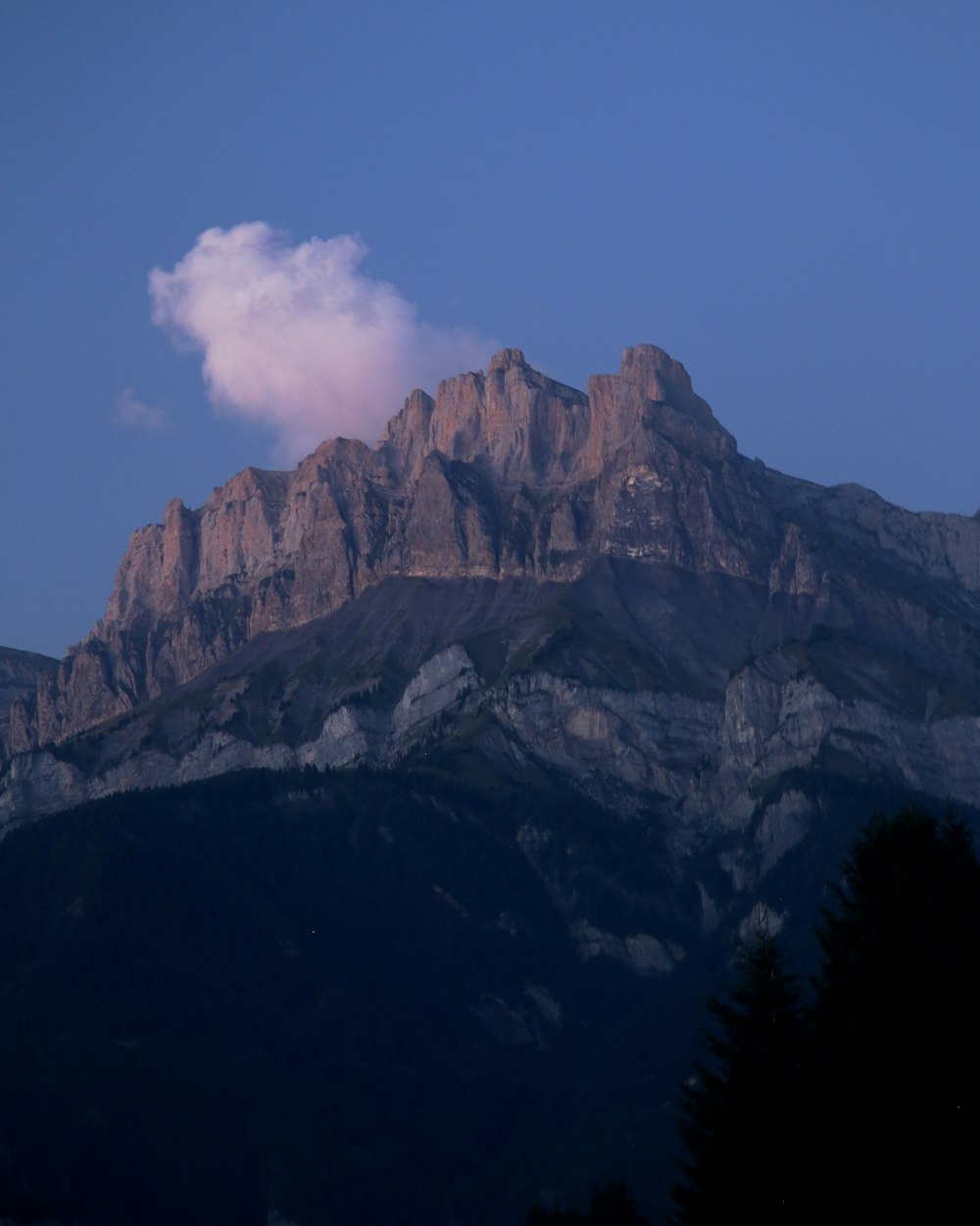 mountain under cloudy sky during daytime