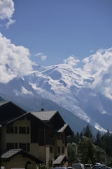 A scenic view of the Swiss Alps with clear skies.