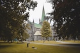 Peaceful garden area beside the cathedral with benches and greenery