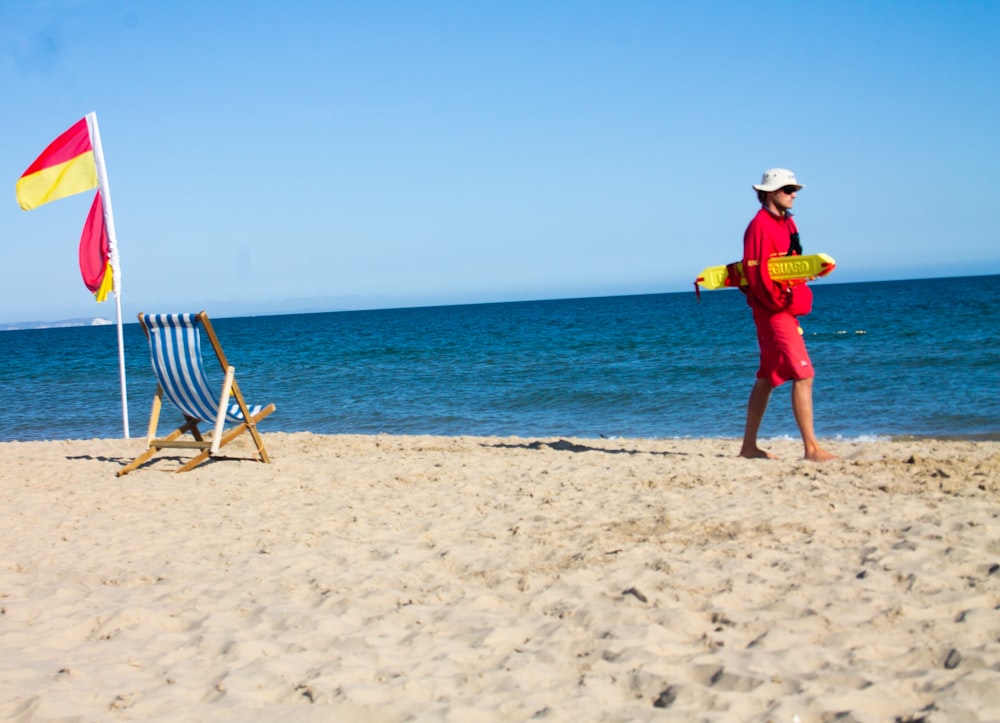 person walking on seashore