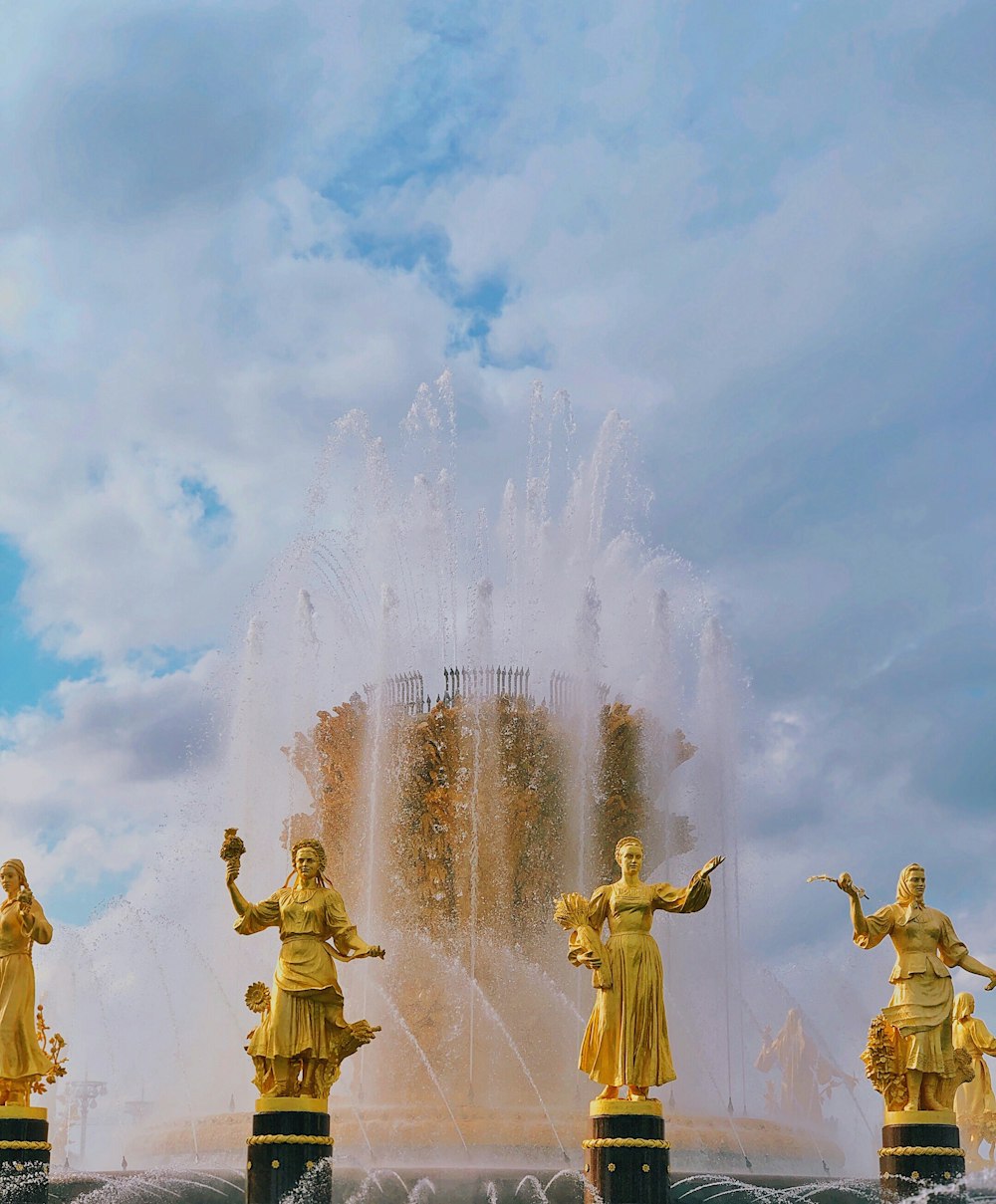 water fountain under cloudy sky