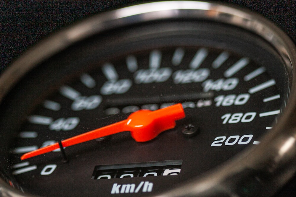 shallow focus photo of speedometer