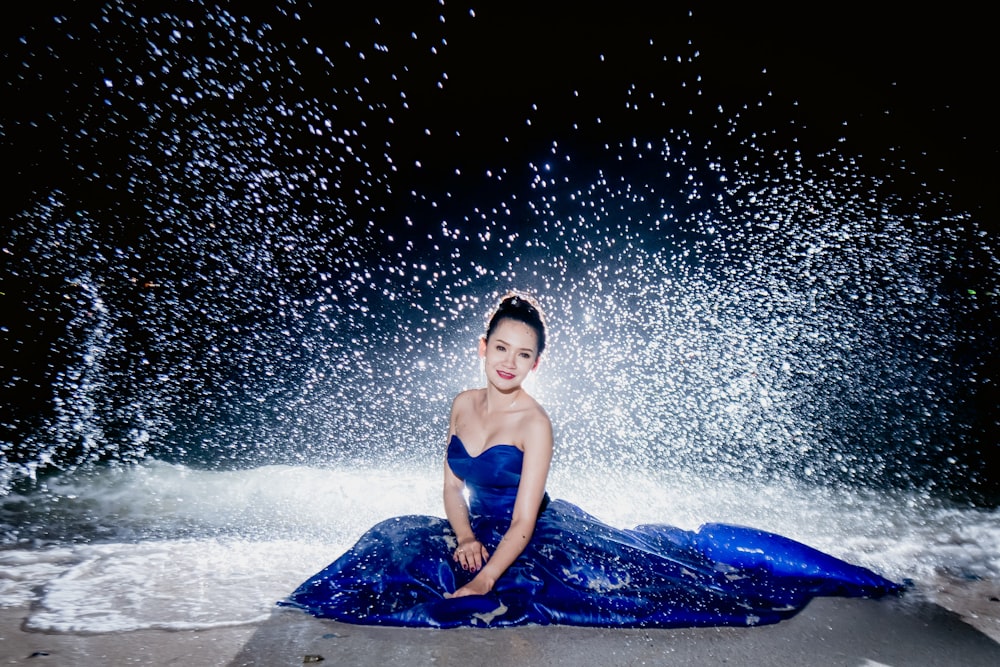 woman in blue sweetheart neckline dress