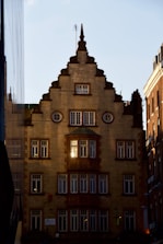 Architectural details of a modern building symbolizing stability and legacy, shot with dramatic lighting.