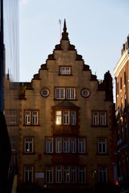 Architectural details of a modern building symbolizing stability and legacy, shot with dramatic lighting.