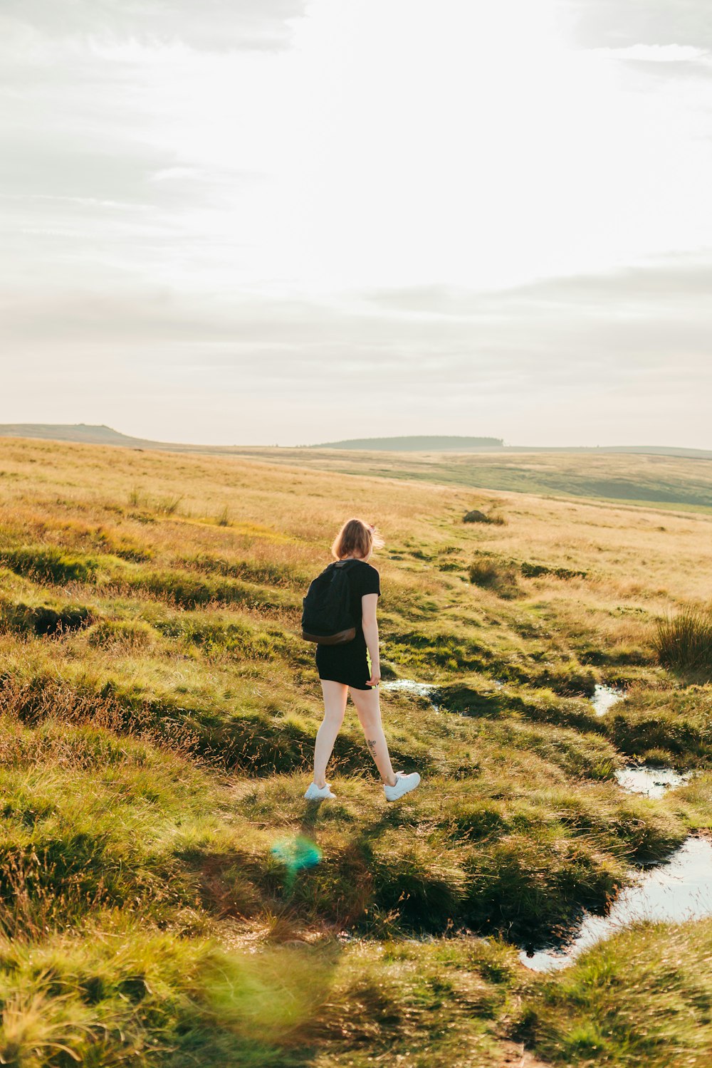 person walking on hill