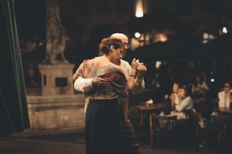 man and woman dancing inside building