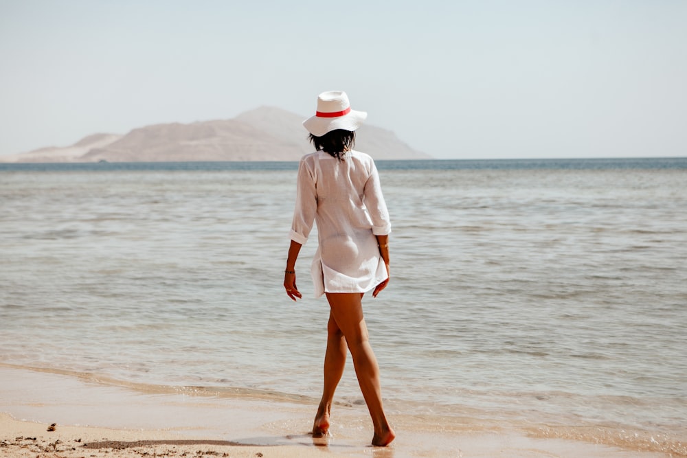 woman walking on seashore