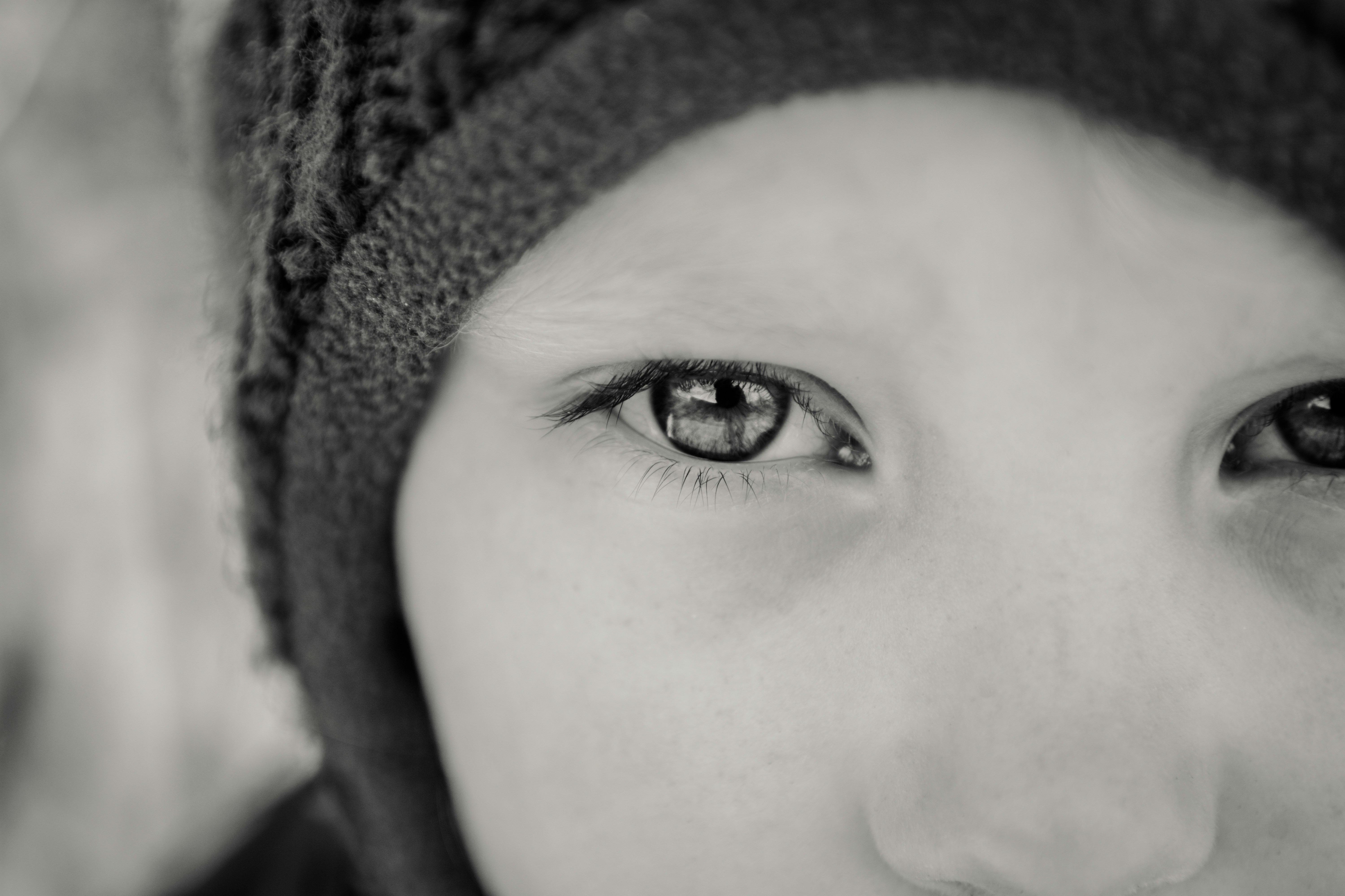 grayscale photography of person wearing knit cap
