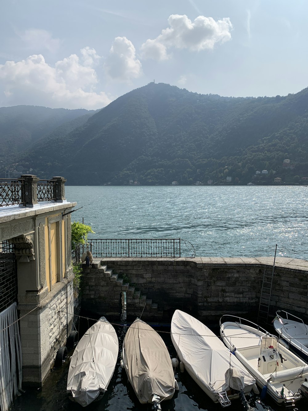 a group of boats sitting next to a building