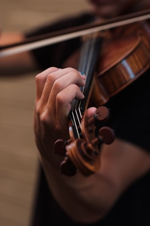 violinist playing on his instrument