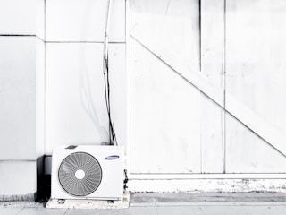 grayscale photography of outdoor AC unit