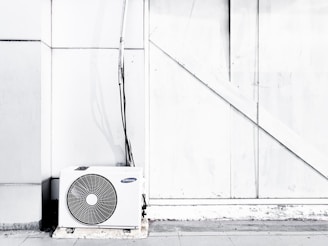 grayscale photography of outdoor AC unit