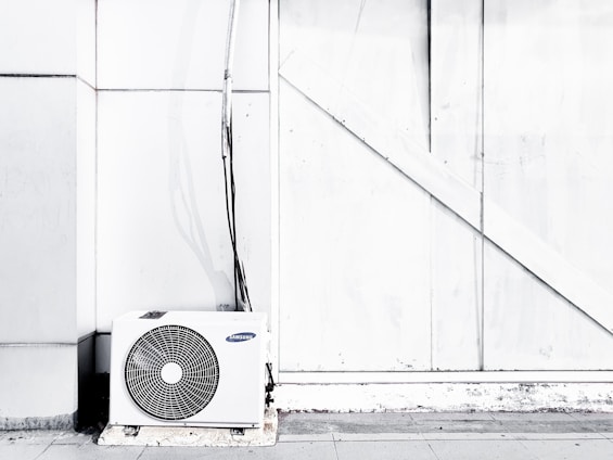 grayscale photography of outdoor AC unit