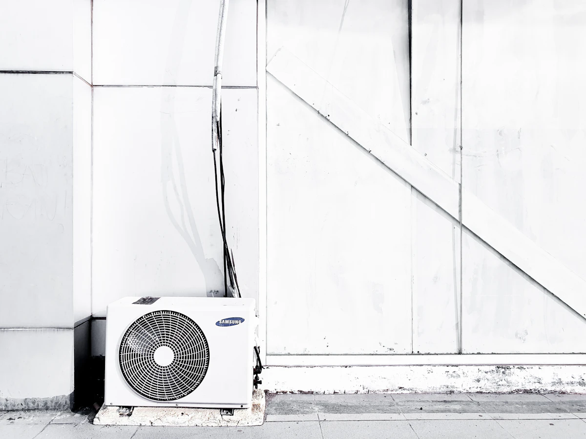 22-year-old condenser retired for a cold-climate heat pump in Bronte — $2,400 in HER+ and Enbridge rebates — before