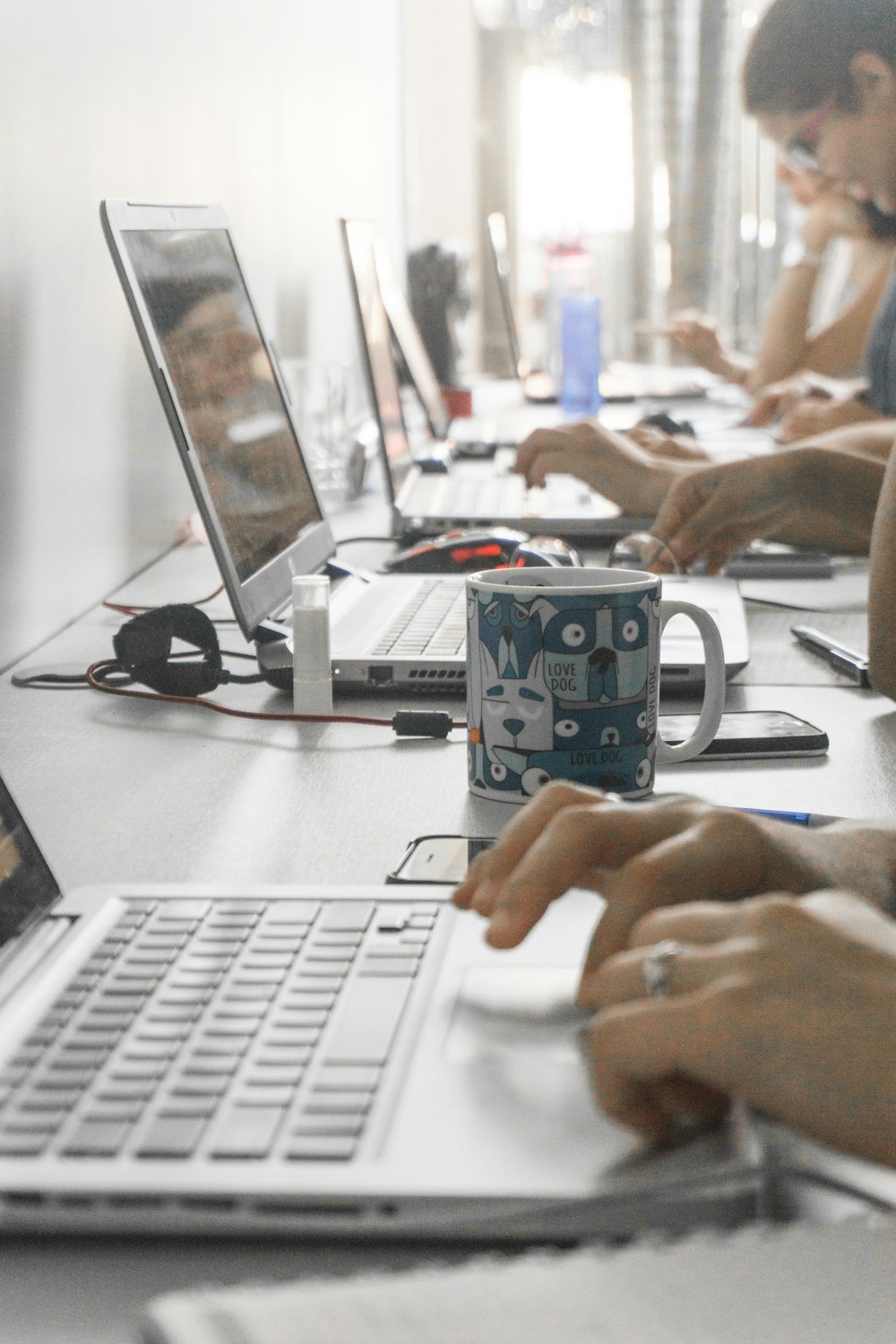 people sitting and using individual laptops