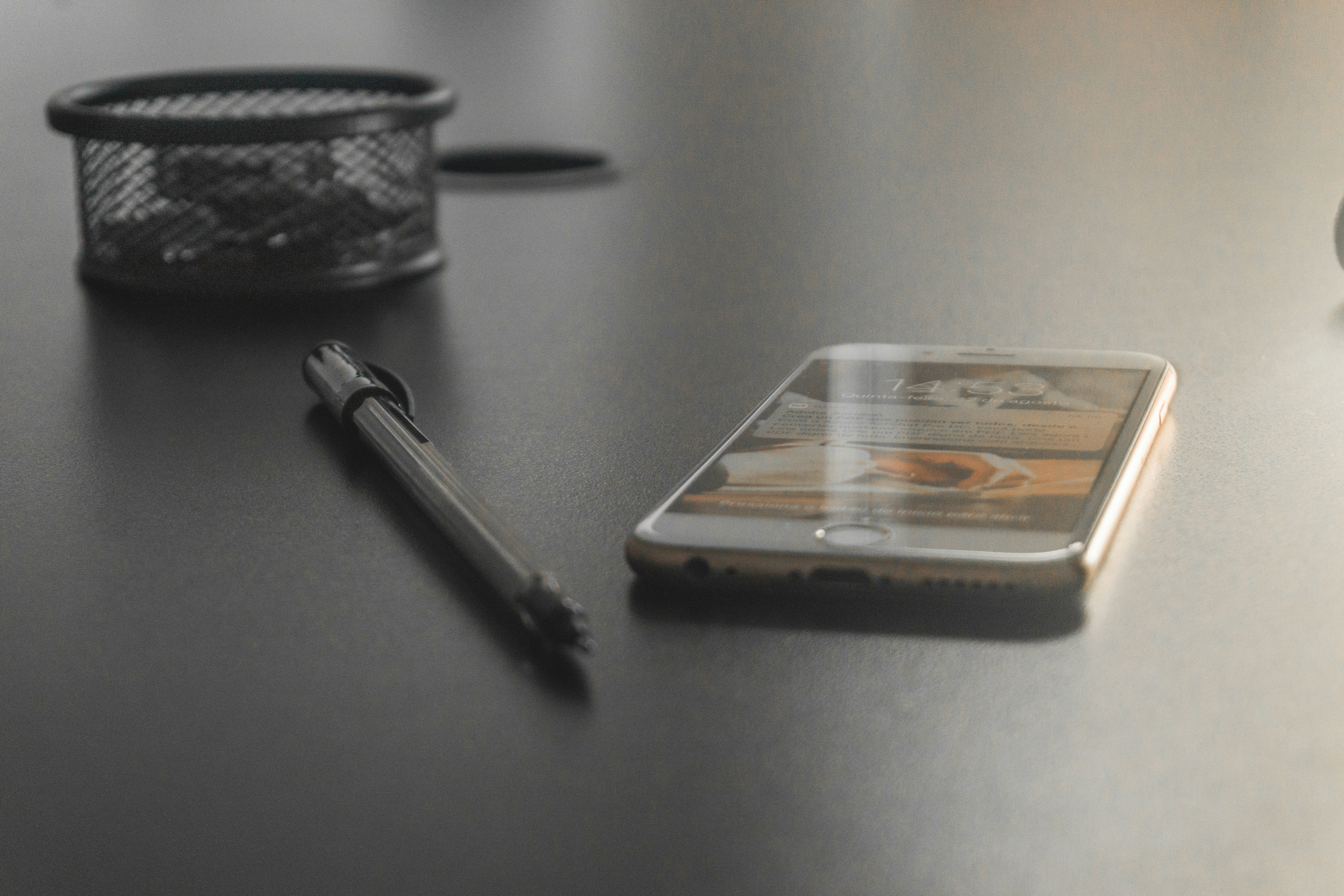 Gold iPhone 6 showing mobile wallet interface