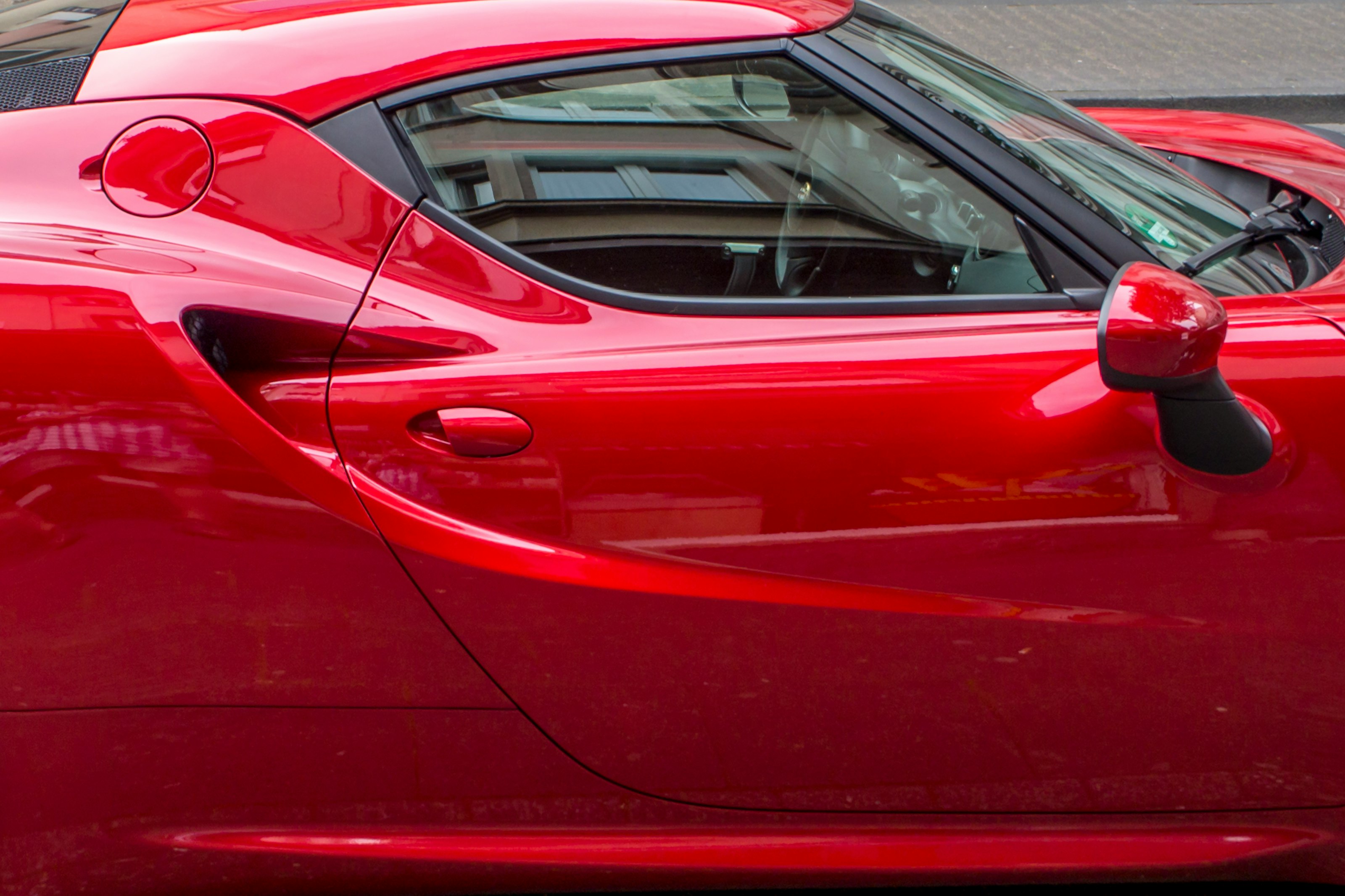 red coupe during daytime