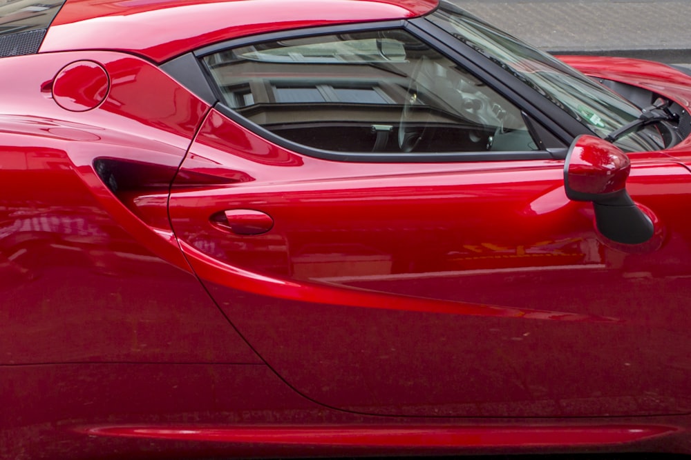 red coupe during daytime