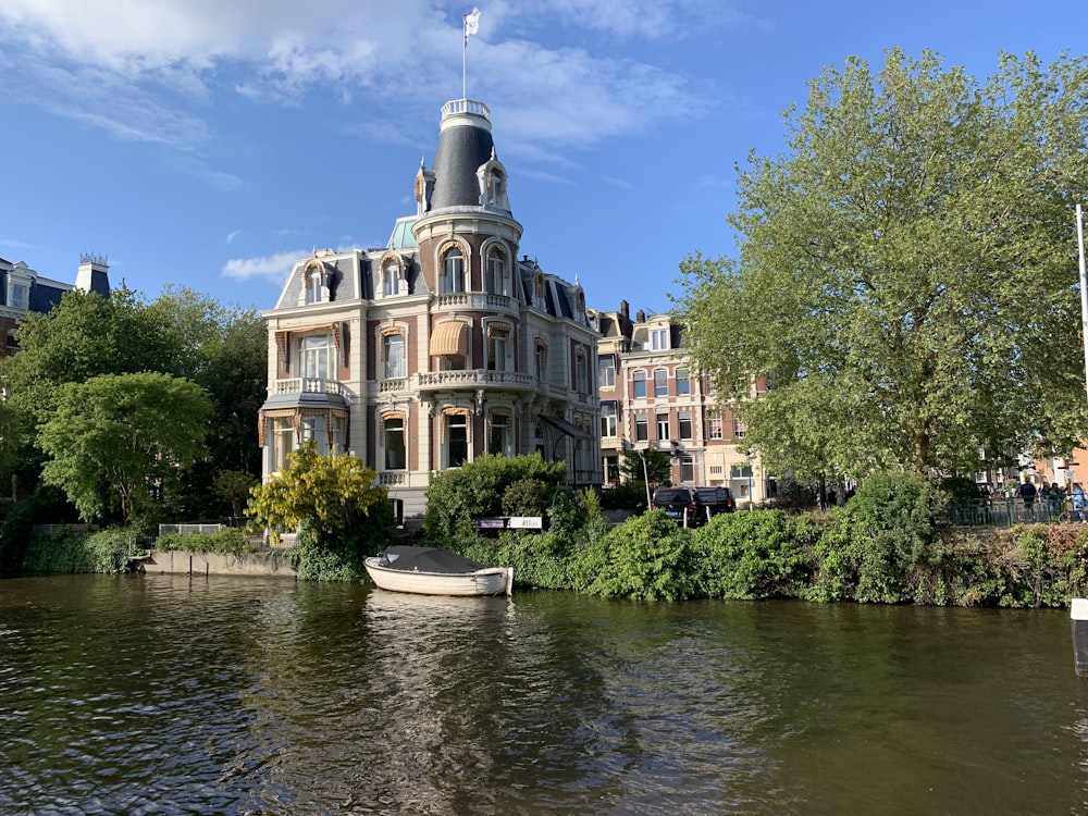 gray building near body of water