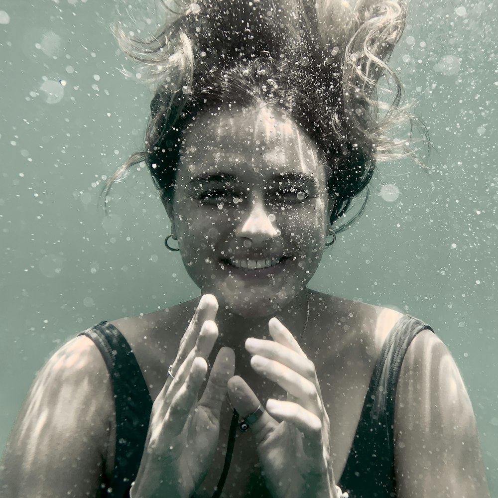 smiling woman underwater