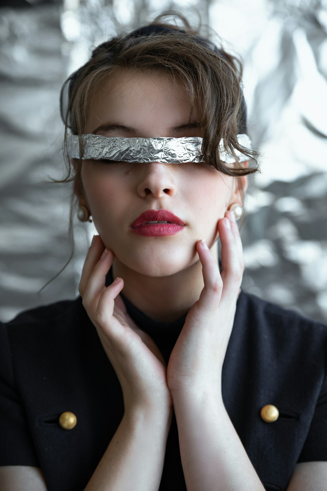 woman with foil eye cover