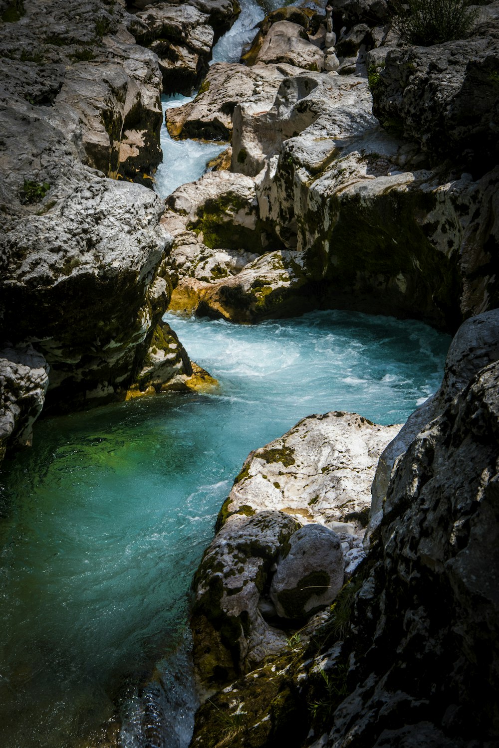 body of water and stones