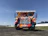 Screenshot of PBJ Trucking homepage featuring bold truck imagery and easy navigation.