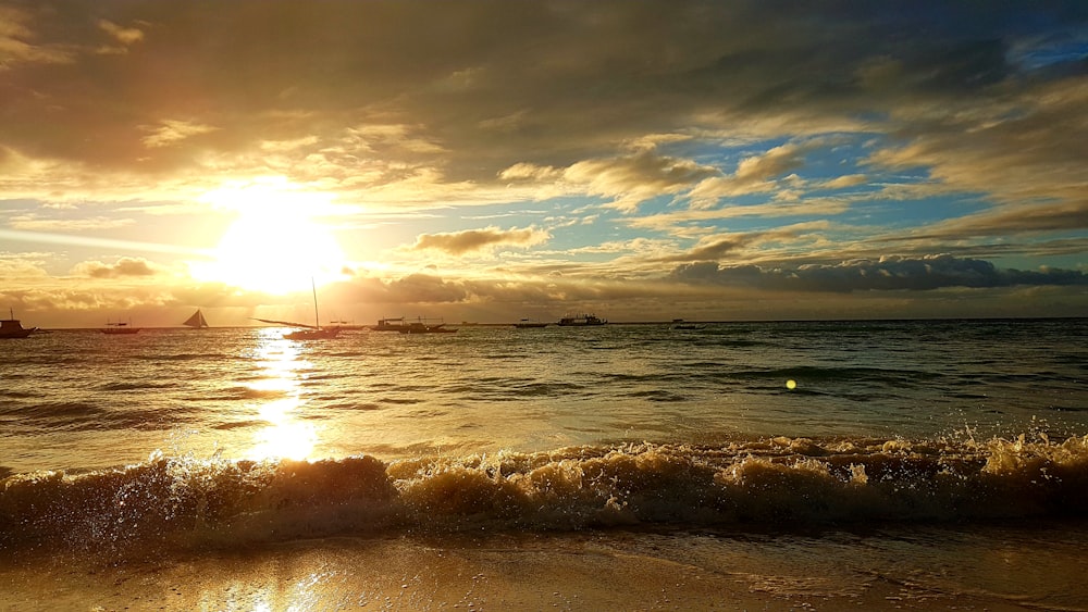 silhouette photo of sea during golden hour