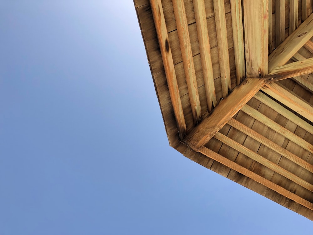 a wooden structure with a blue sky in the background