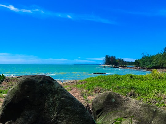 gray and brown rock near body of water in Jalan Pantai Tanjung Batu Malaysia