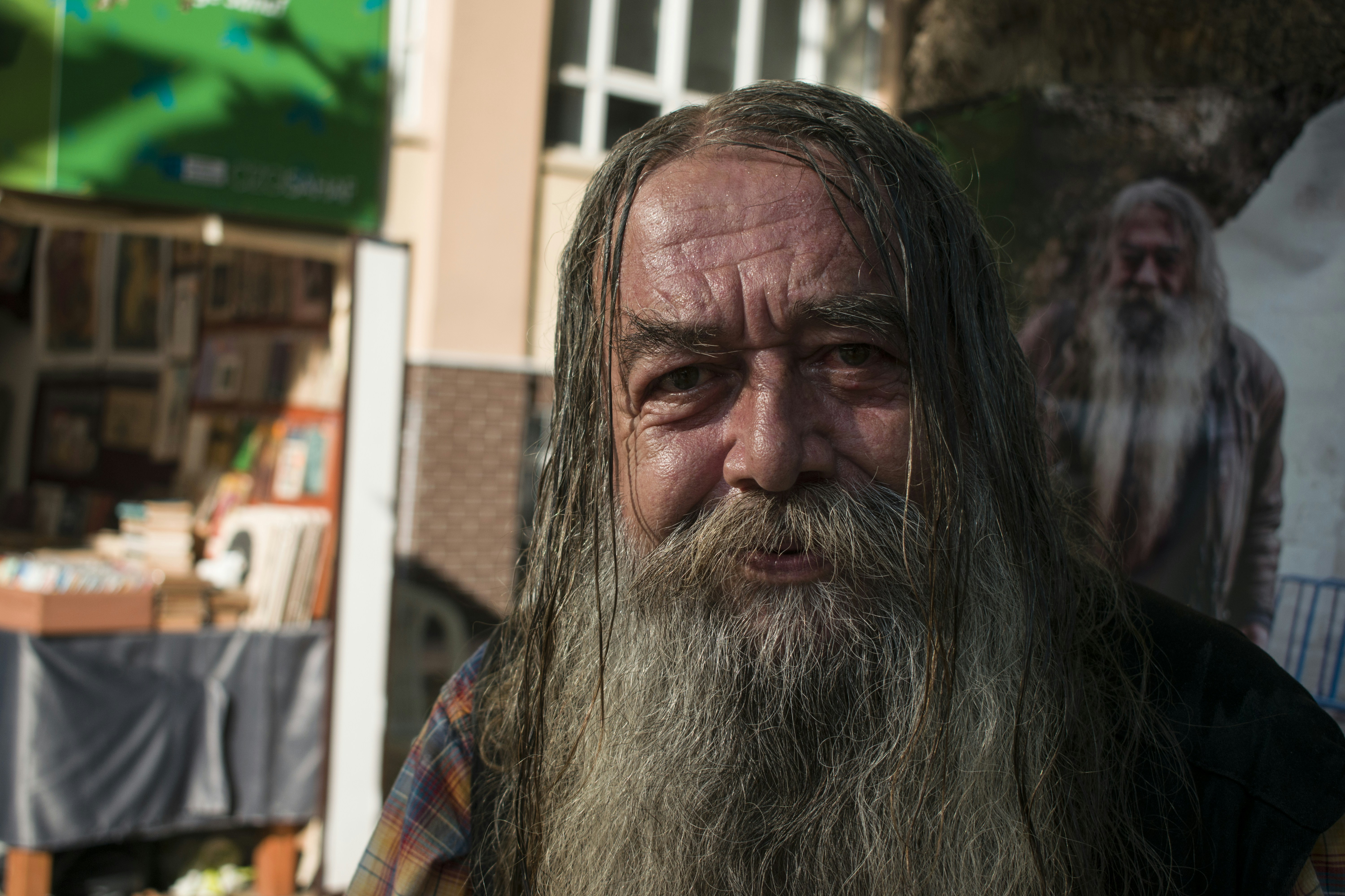 man in blue and brown top