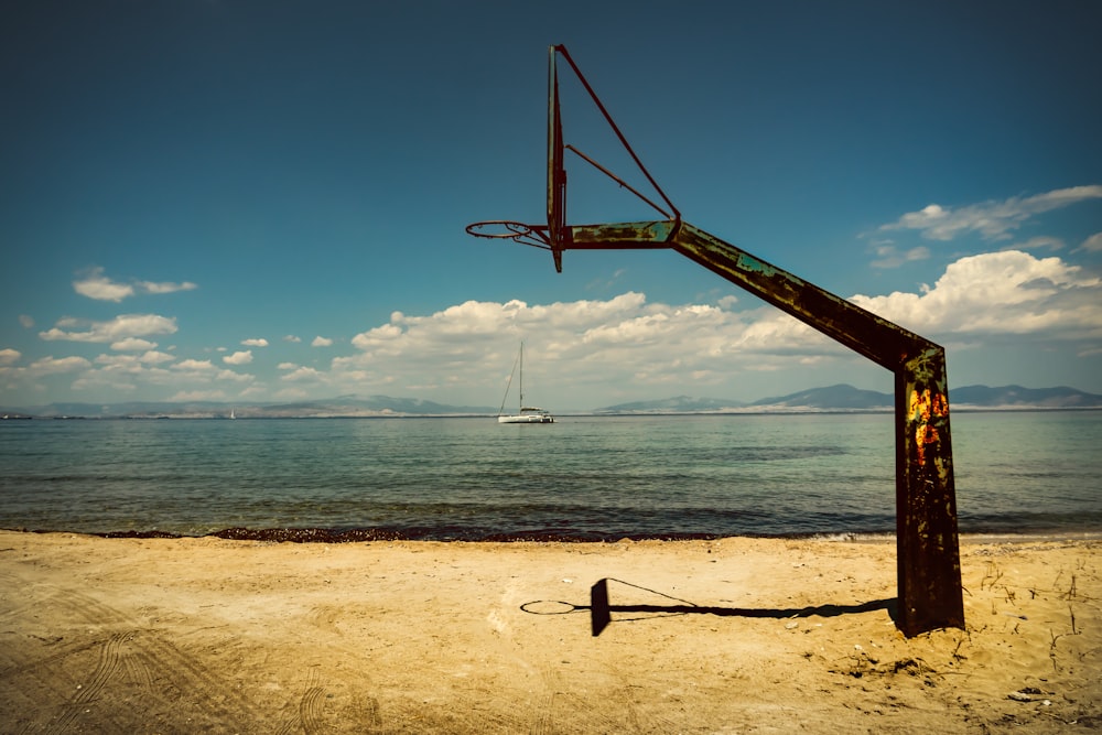 black basketball hoop on seashore during daytime
